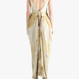 White dress worn by a person, showing the loose fit.