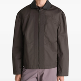Brown jacket worn by a person, showing the jacket fit