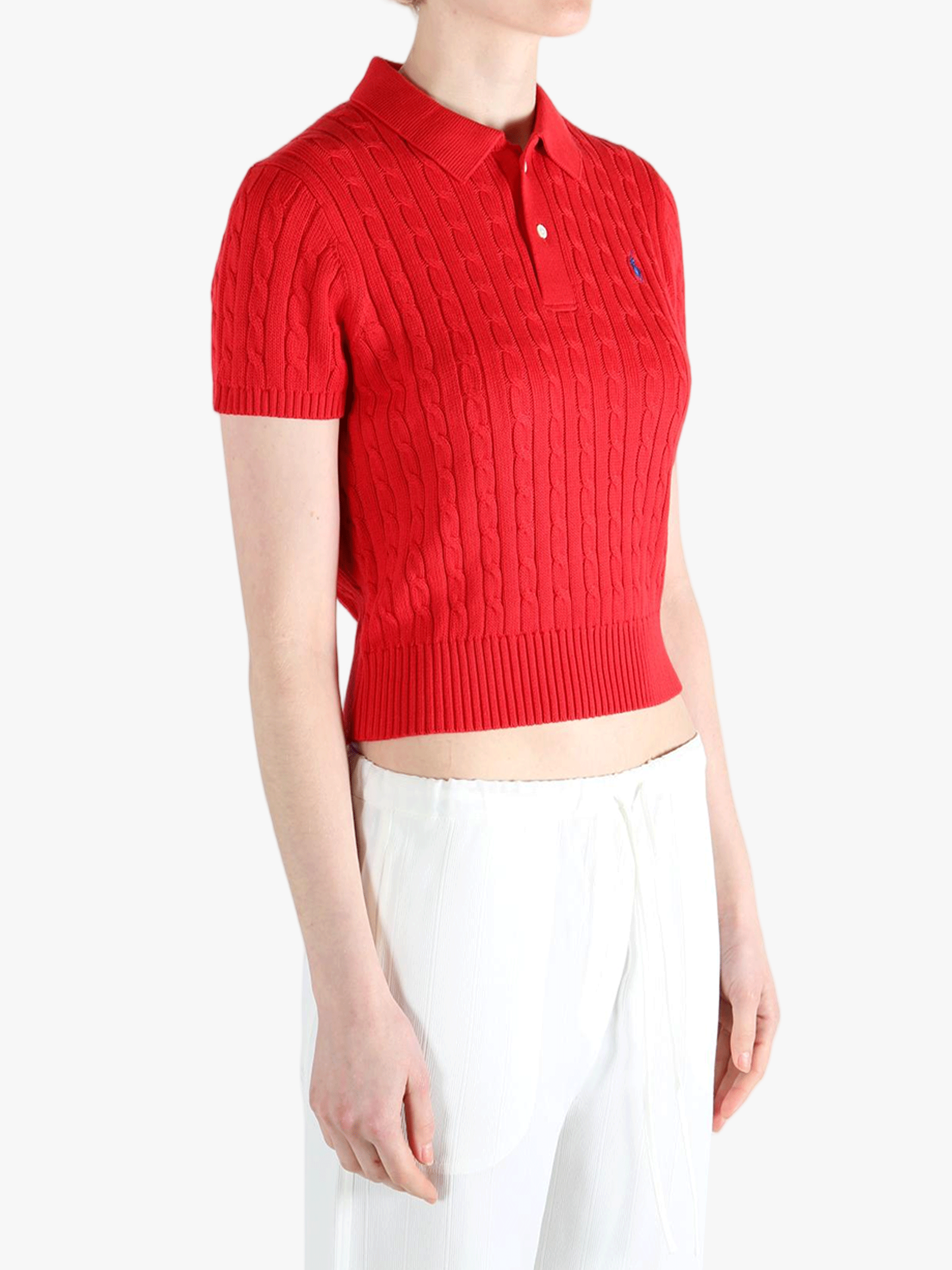 Red knitwear, worn by a person, showing the knitwear's fit
