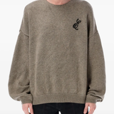 brown sweater worn by a person, showing the sweater fit