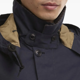 close up of blue jackets and coats, showing texture of the cotton  fabric
