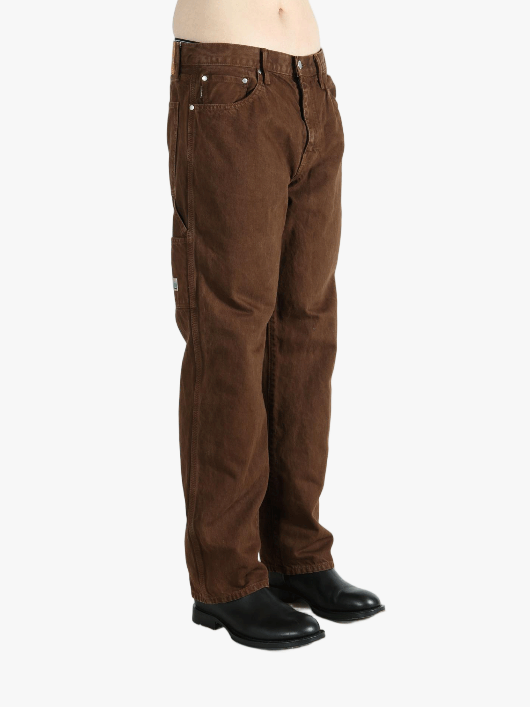 Brown pants worn by a person, showing the pants fit