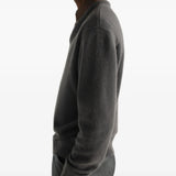 Grey knitwear worn by a person, showing the knitwear fit