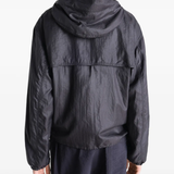 Black jacket worn by a person, showing the jacket fit