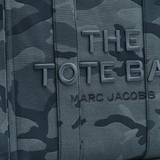 Close up of blue bags, showing texture of the cotton fabric.