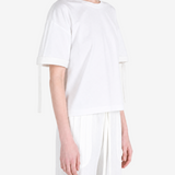White t-shirt worn by a person, showing the t-shirt fit