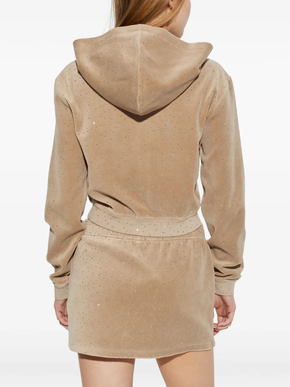 Tan hoodie worn by a person, showing the hoodie fit