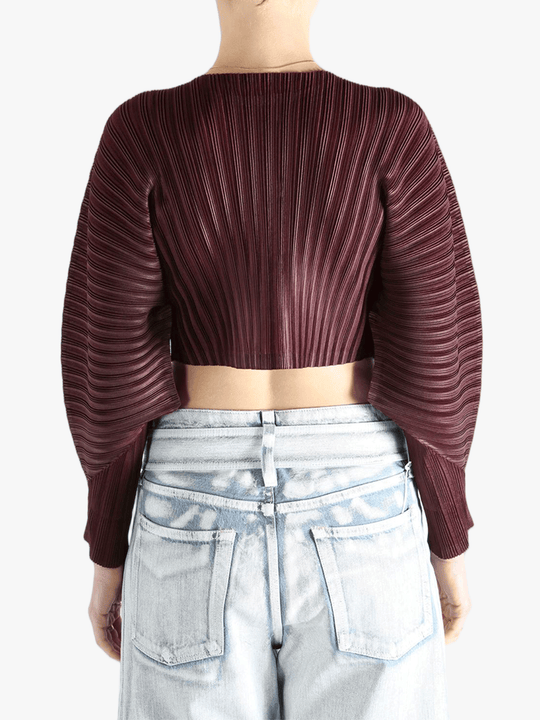 Brown cardigan worn by a person, showing the cardigan's fit