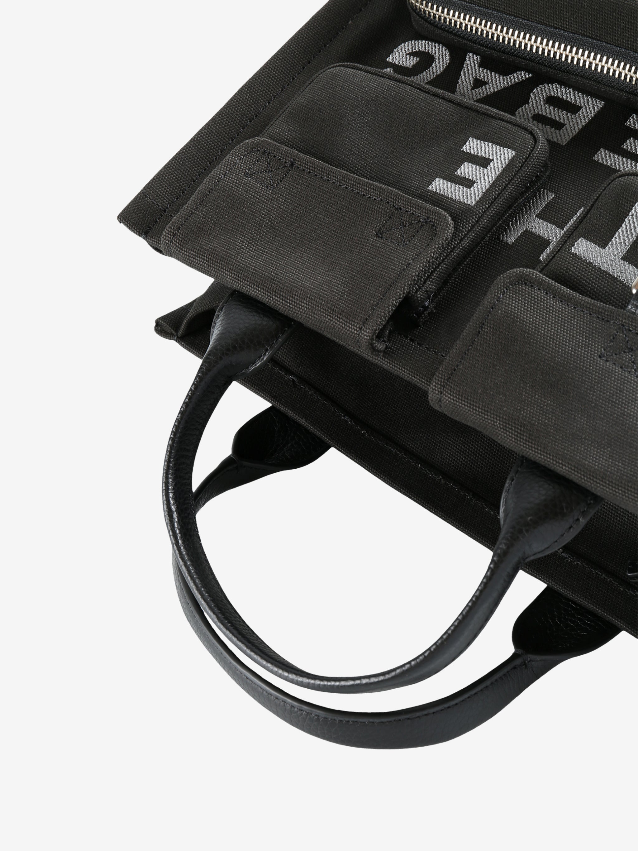 Close up of black bag,, showing texture of the cotton fabric