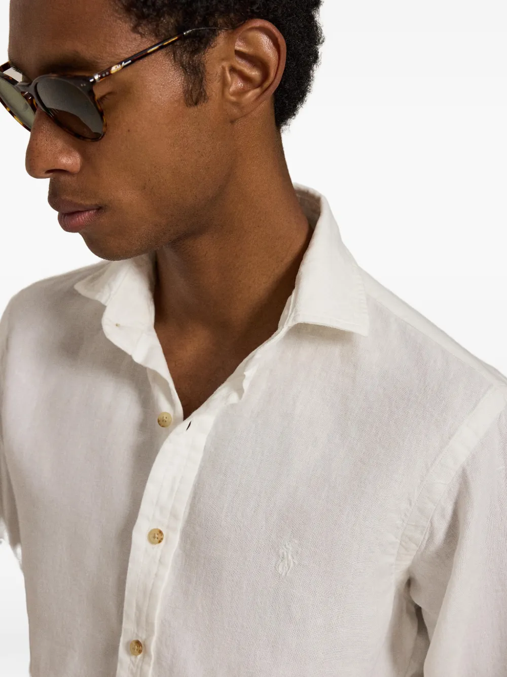 White shirt worn by a person, showing the shirt fit