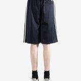 Navy shorts worn by a person, showing the shorts fit