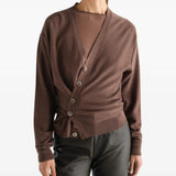 Brown knitwear worn by a person, showing the knitwear fit