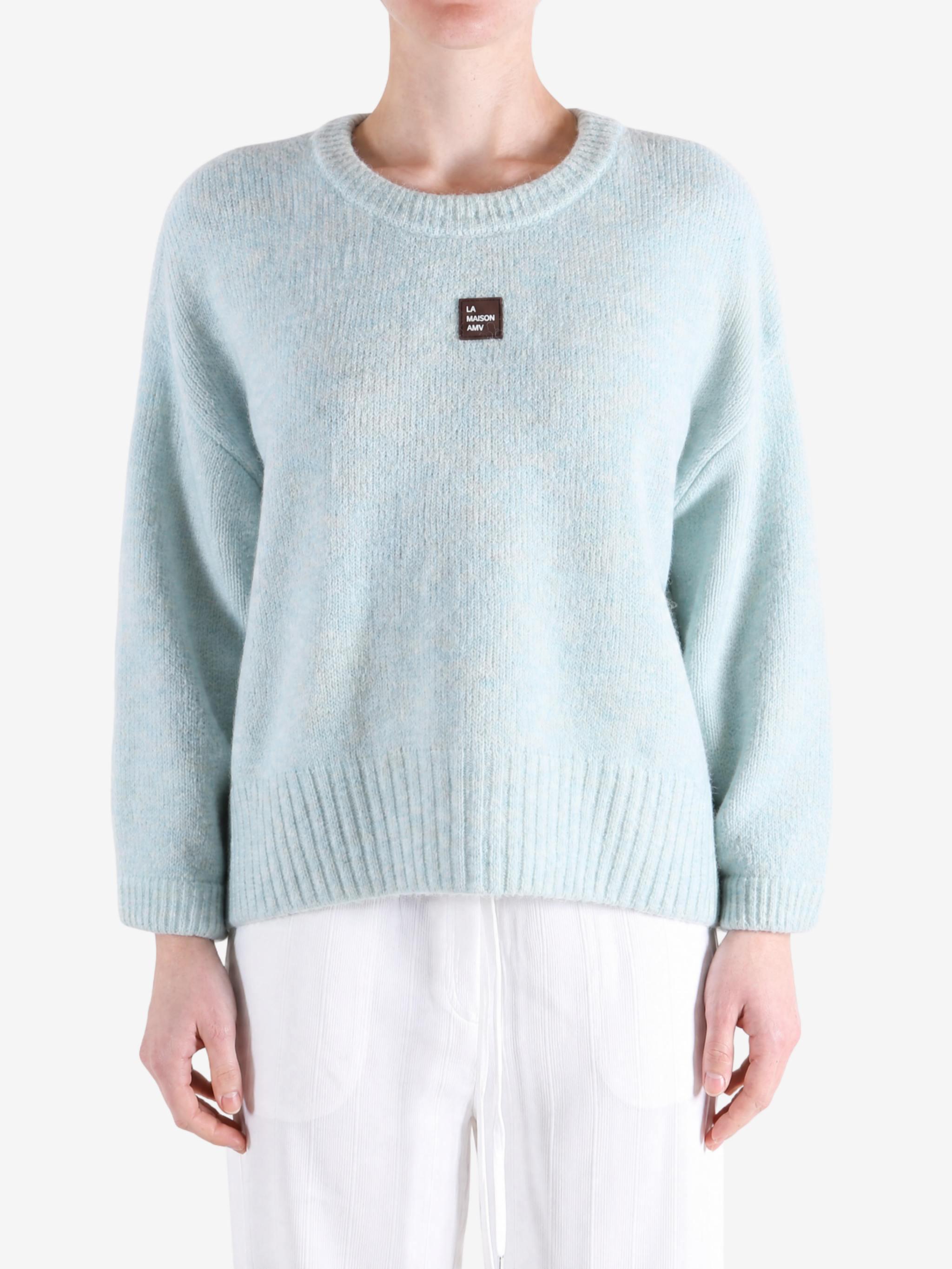 Blue hoodie worn by a person, showing the hoodie fit