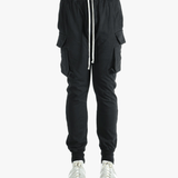 Black pants worn by a person, showing the pants fit