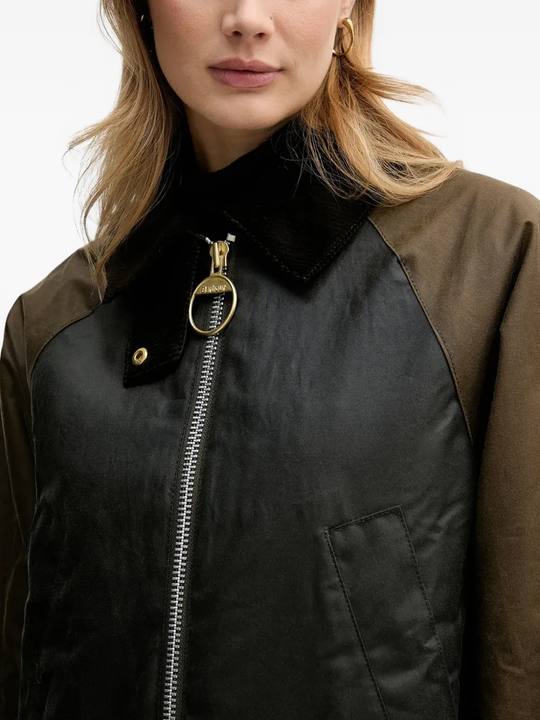 Brown jacket worn by a person, showing the jacket fit