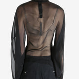 Black top worn by a person, showing the top's fit