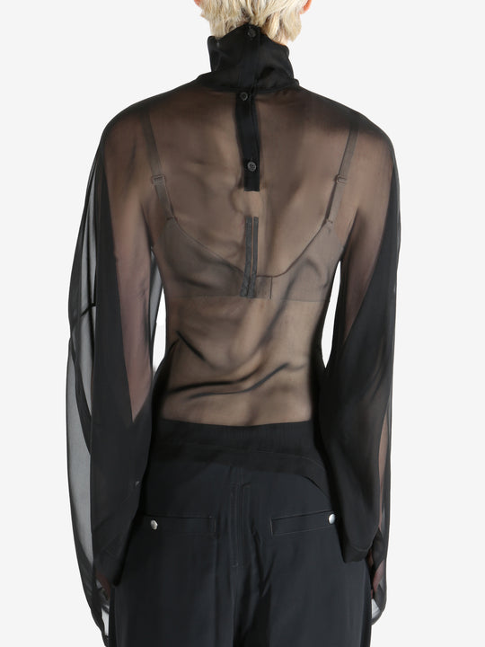 Black top worn by a person, showing the top's fit