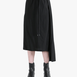 Black skirt worn by a person, showing the skirt fit
