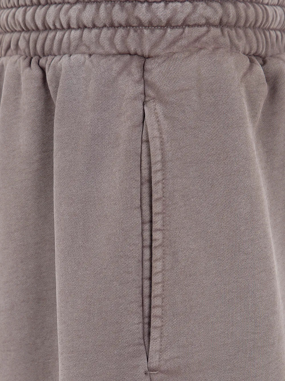 Close up of Brown shorts, showing texture of the 100% cotton fabric