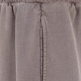 Close up of Brown shorts, showing texture of the 100% cotton fabric