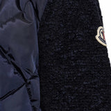 Close up of Navy jacket, showing texture of the 100% polyamide fabric