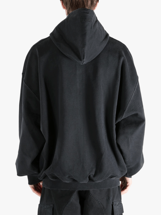 Black hoodie worn by a person, showing the hoodie fit