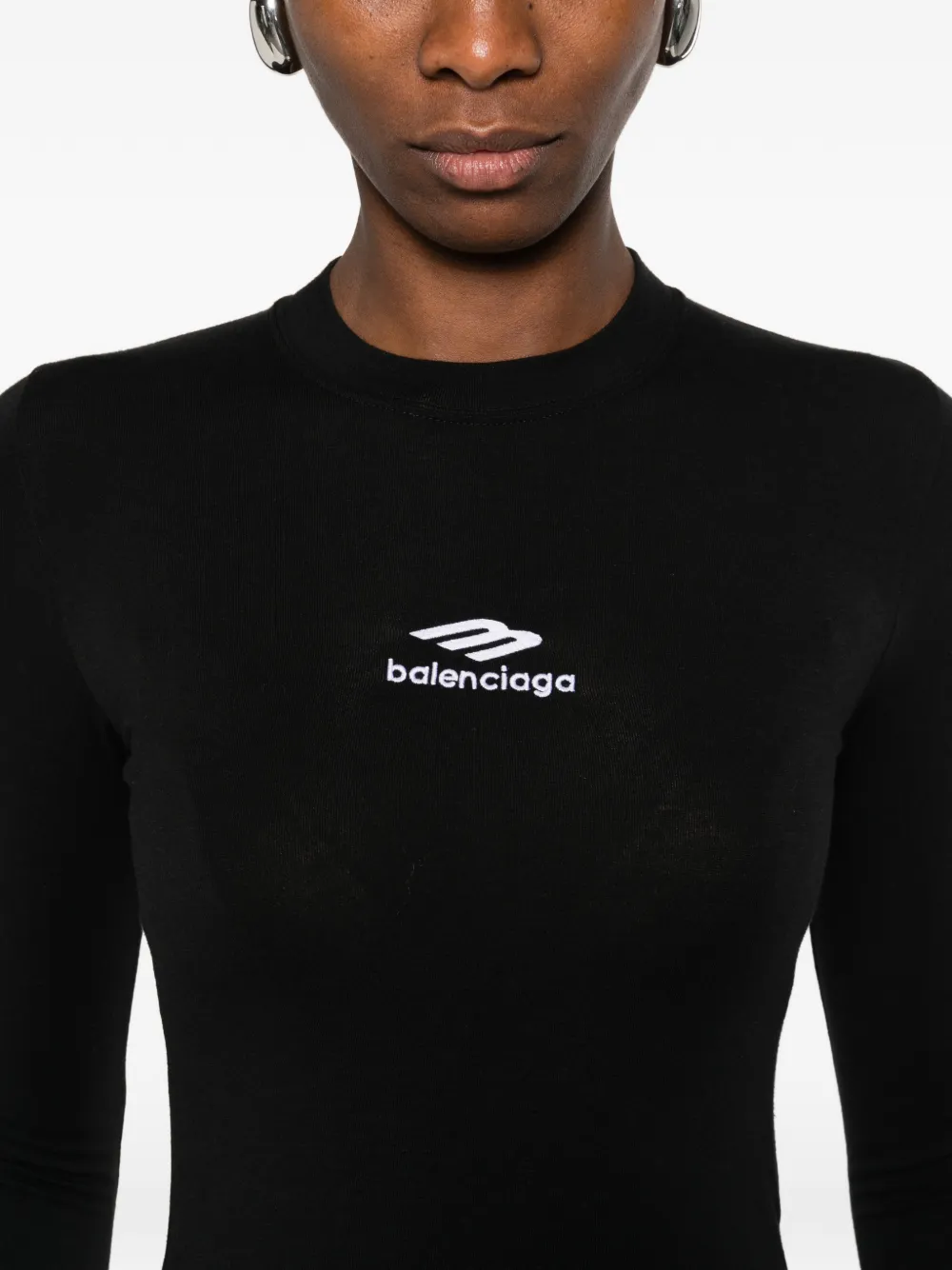 close up of black tops, showing texture of the cotton fabric