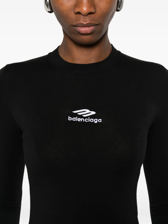 close up of black tops, showing texture of the cotton fabric