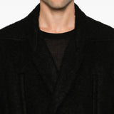 Black jacket worn by a person, showing the jacket fit