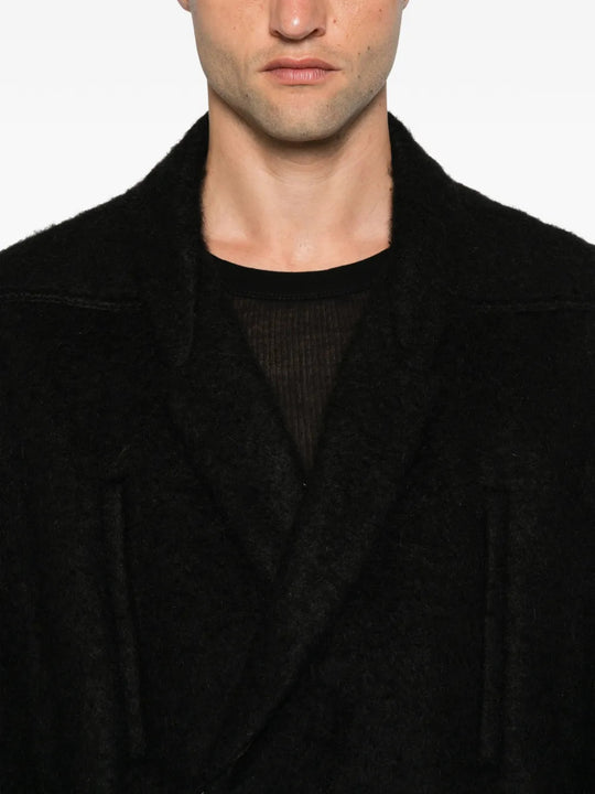 Black jacket worn by a person, showing the jacket fit