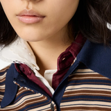 Close up of red shirt, showing texture of the Virgin Wool fabric