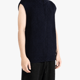 Navy knitwear worn by a person, showing the knitwear fit