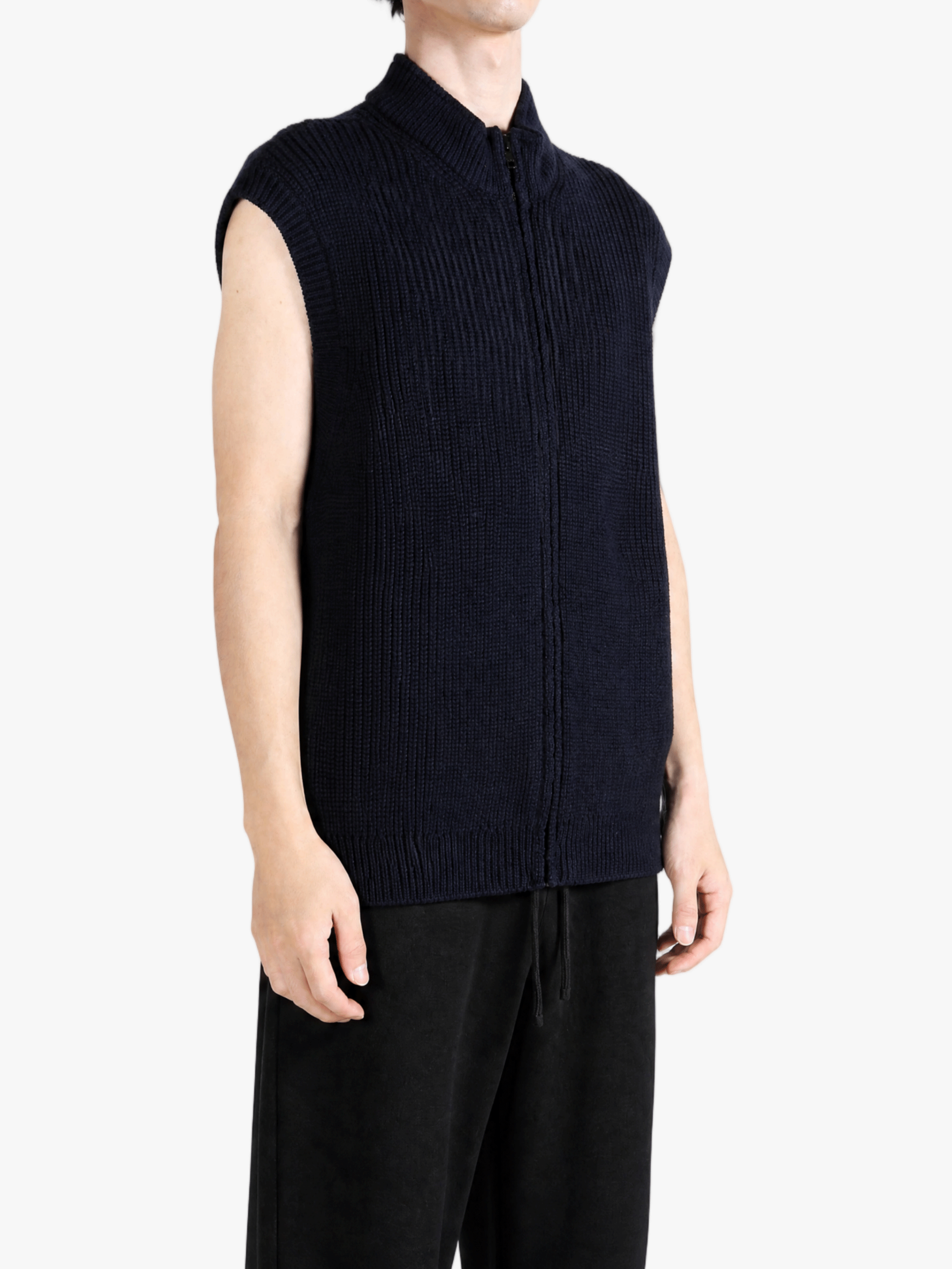 Navy knitwear worn by a person, showing the knitwear fit