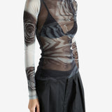 Grey top worn by a person, showing the top's fit