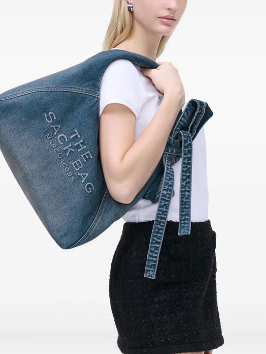 blue bags worn by a person, showing the bags fit