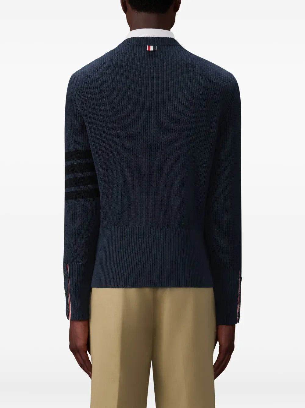 Navy pullover worn by a person, showing the pullover's fit