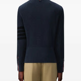 Navy pullover worn by a person, showing the pullover's fit