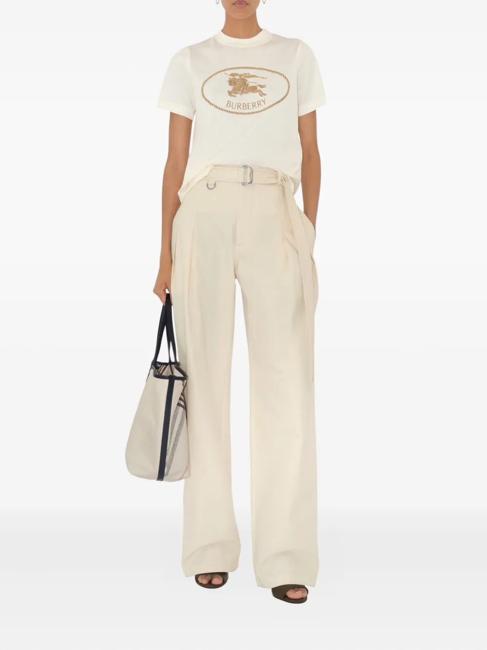 Tan top worn by a person, showing the top's fit