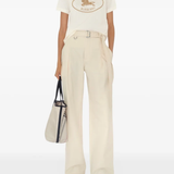 Tan top worn by a person, showing the top's fit