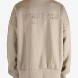 Tan hoodies worn by a person, showing the hoodies fit