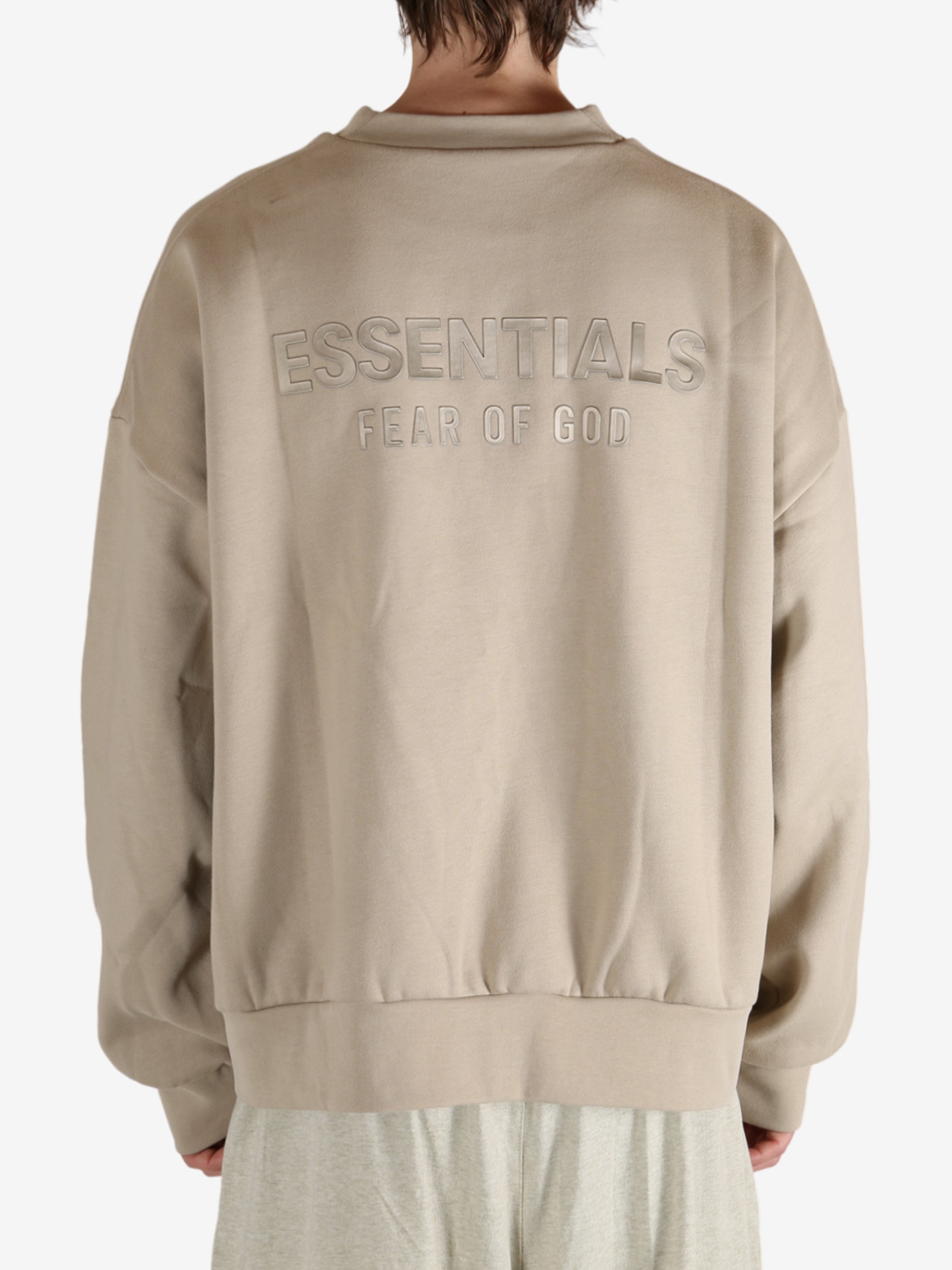 Tan hoodies worn by a person, showing the hoodies fit