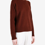 Brown t-shirt worn by a person, showing the t-shirt fit
