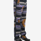 Black pants worn by a person, showing the pants' fit