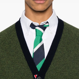 Close up of green knitwear, showing texture of the Wool fabric