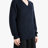 Navy top worn by a person, showing the top fit