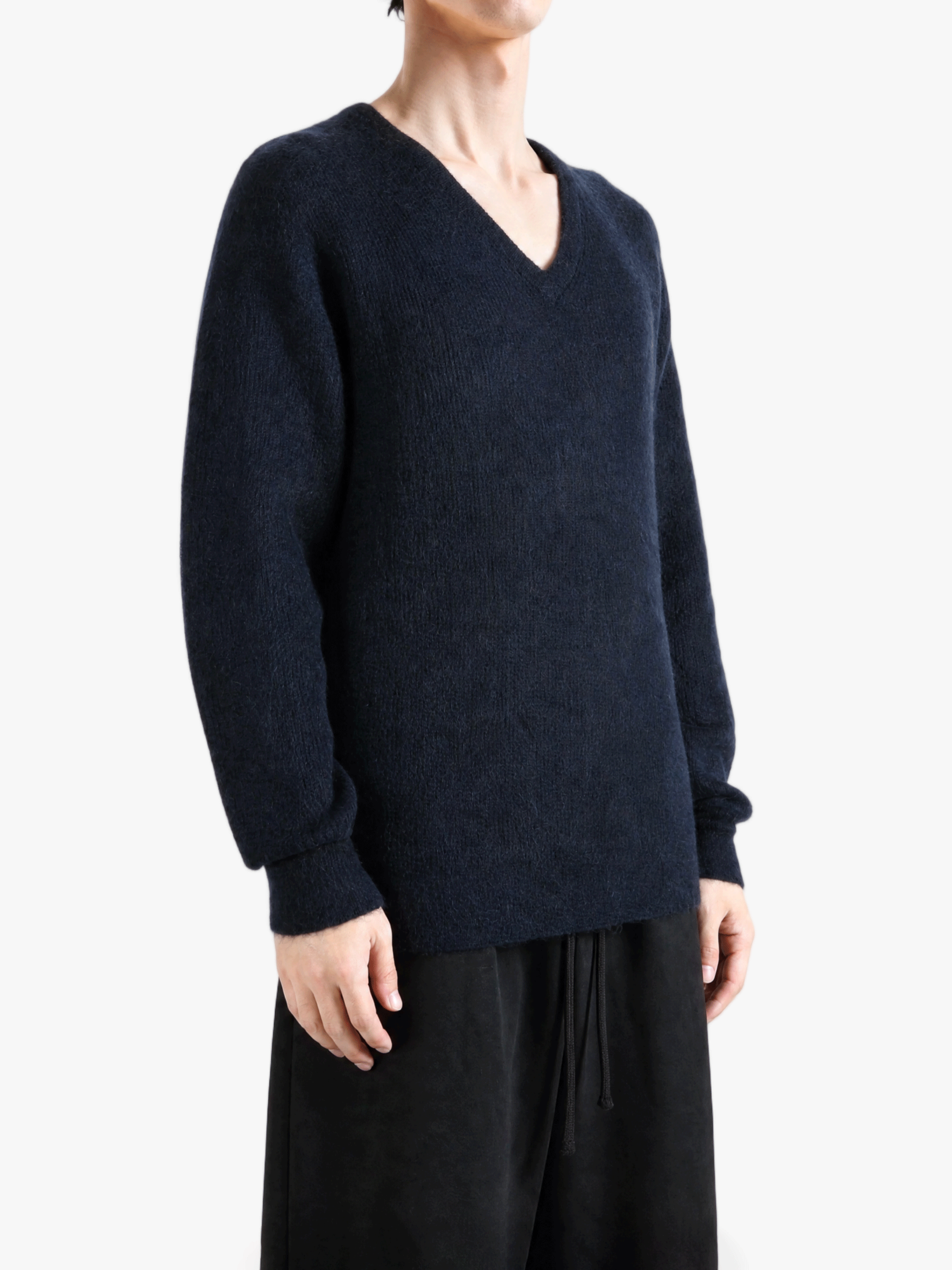 Navy top worn by a person, showing the top fit