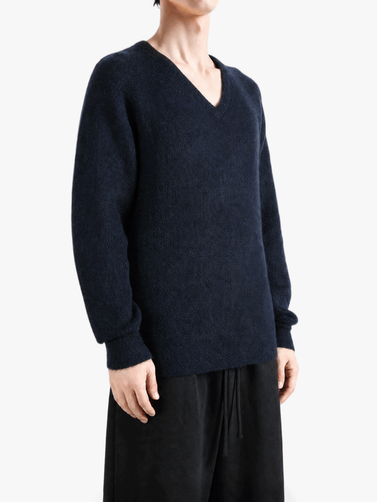 Navy top worn by a person, showing the top fit