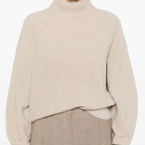 Tan knitwears worn by a person, showing the knitwears fit