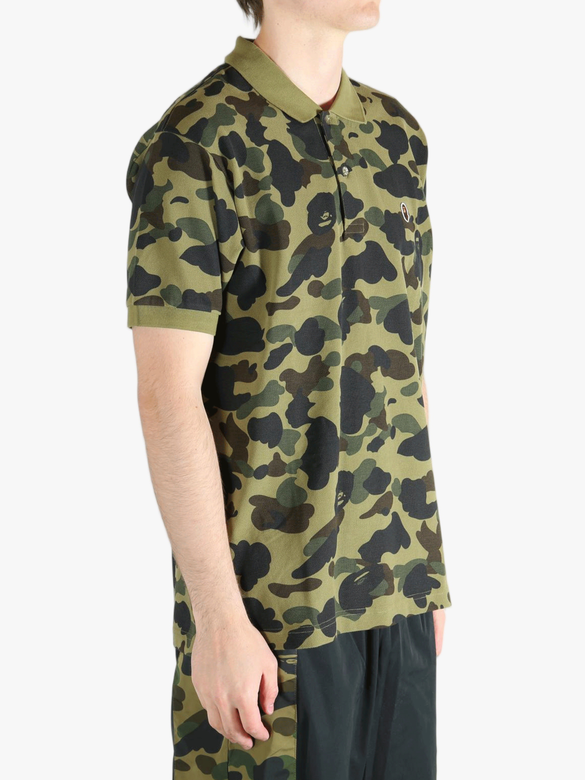 Green shirt worn by a person, showing the shit fit