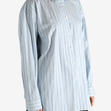 Blue shirts worn by a person, showing the shirts fit